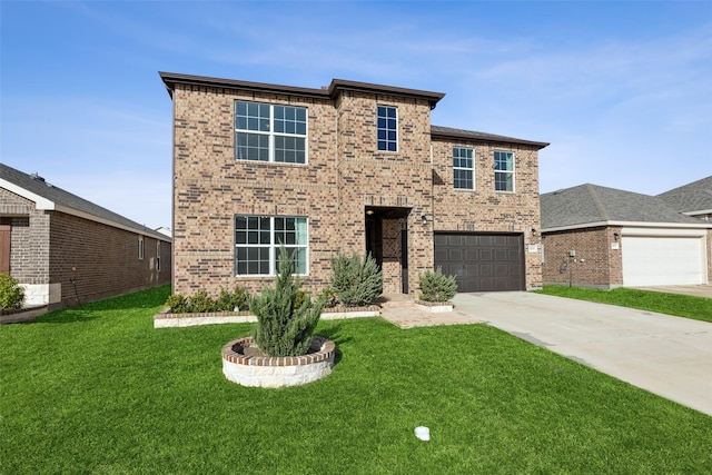 view of front of property featuring a garage and a front yard