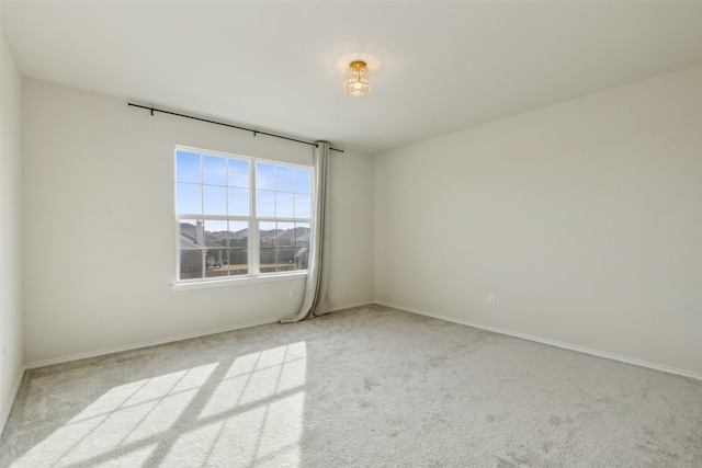 empty room featuring light carpet