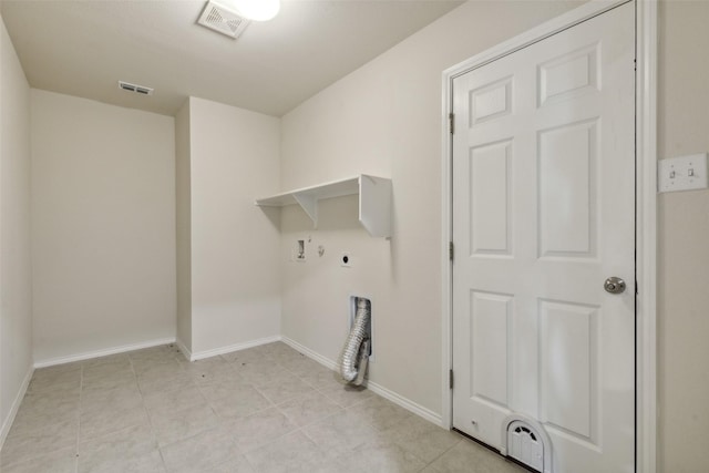 laundry area featuring hookup for an electric dryer, washer hookup, light tile patterned floors, and hookup for a gas dryer