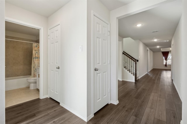 hallway with dark wood-type flooring