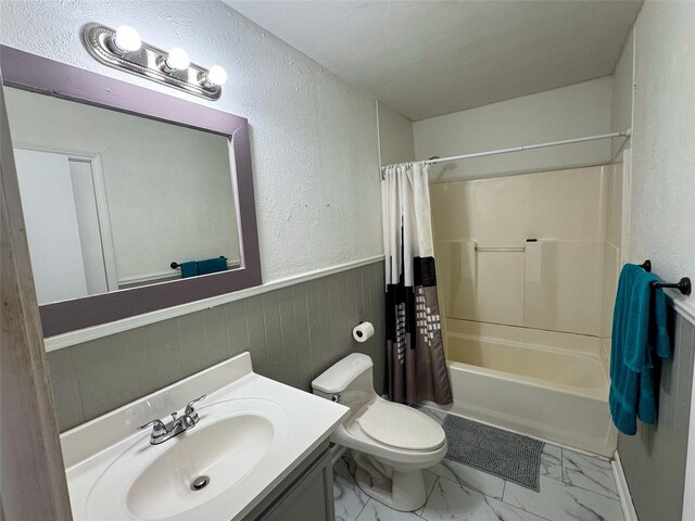 full bathroom featuring vanity, toilet, and shower / bathtub combination with curtain