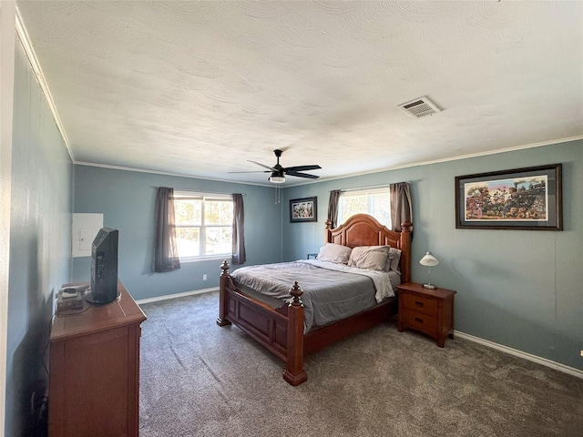 bedroom featuring dark colored carpet, multiple windows, ornamental molding, and ceiling fan