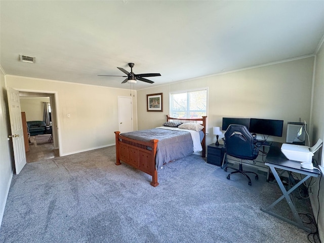 carpeted bedroom featuring ceiling fan and crown molding