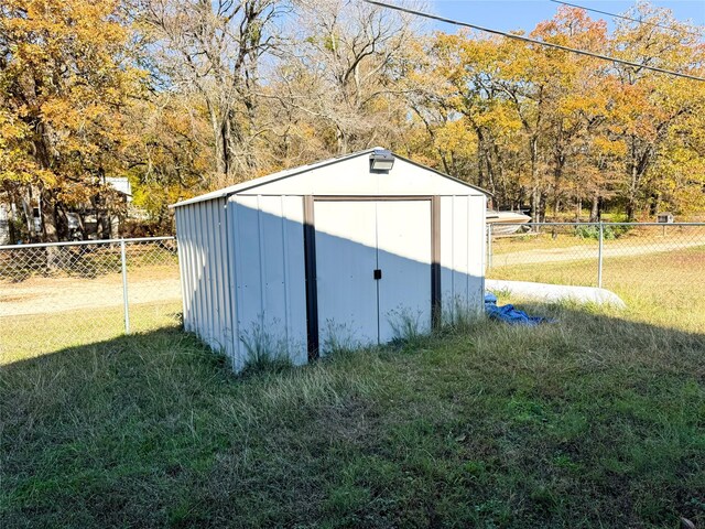 view of outdoor structure featuring a yard