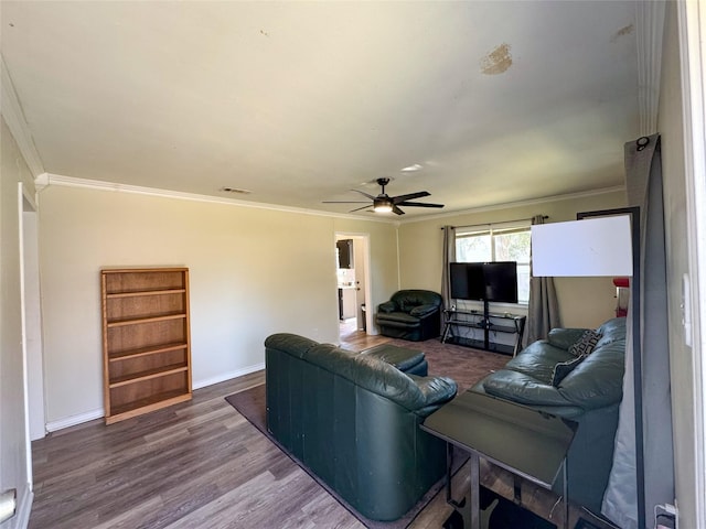 living room featuring hardwood / wood-style flooring, ceiling fan, and crown molding