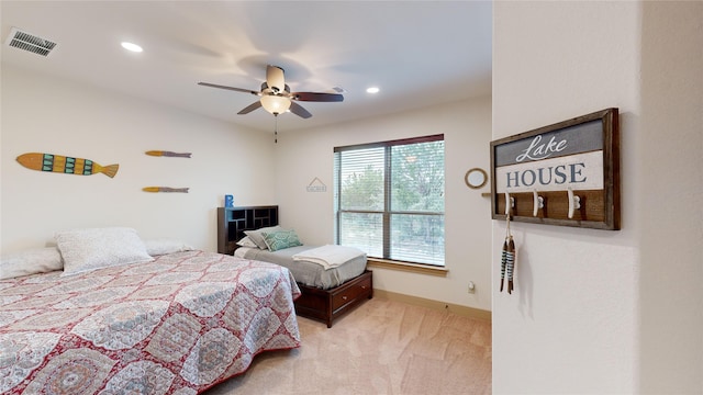 carpeted bedroom featuring ceiling fan