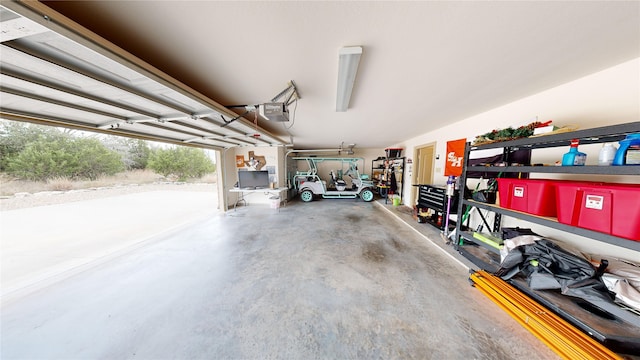 garage featuring a garage door opener