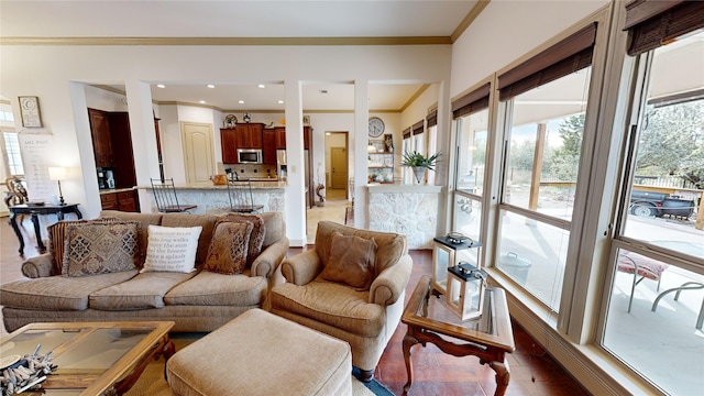 living room with tile patterned floors and crown molding