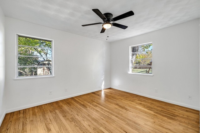 unfurnished room with ceiling fan and light hardwood / wood-style flooring