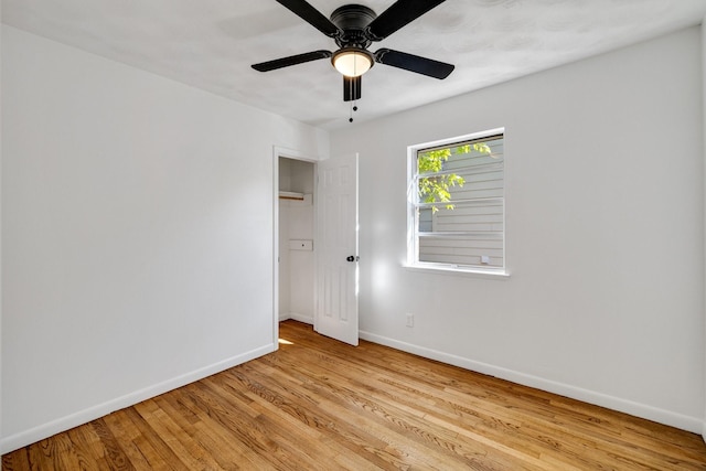 empty room featuring ceiling fan and light wood-type flooring