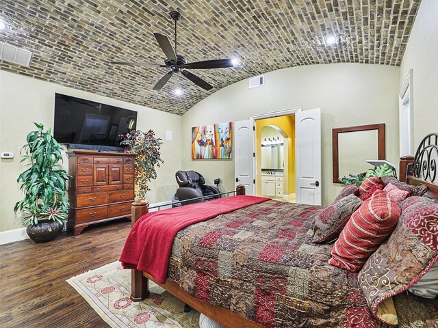 bedroom with ceiling fan, dark hardwood / wood-style flooring, lofted ceiling, and brick ceiling