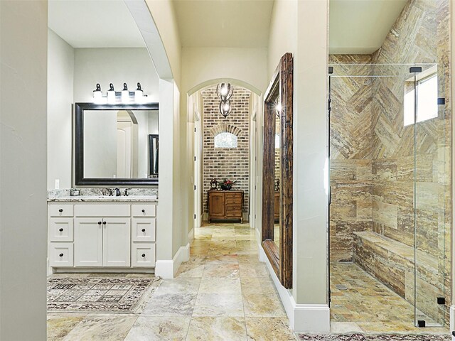 hallway with dark hardwood / wood-style floors, ornamental molding, and a notable chandelier