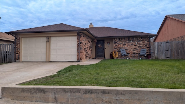 ranch-style house featuring a garage and a front yard