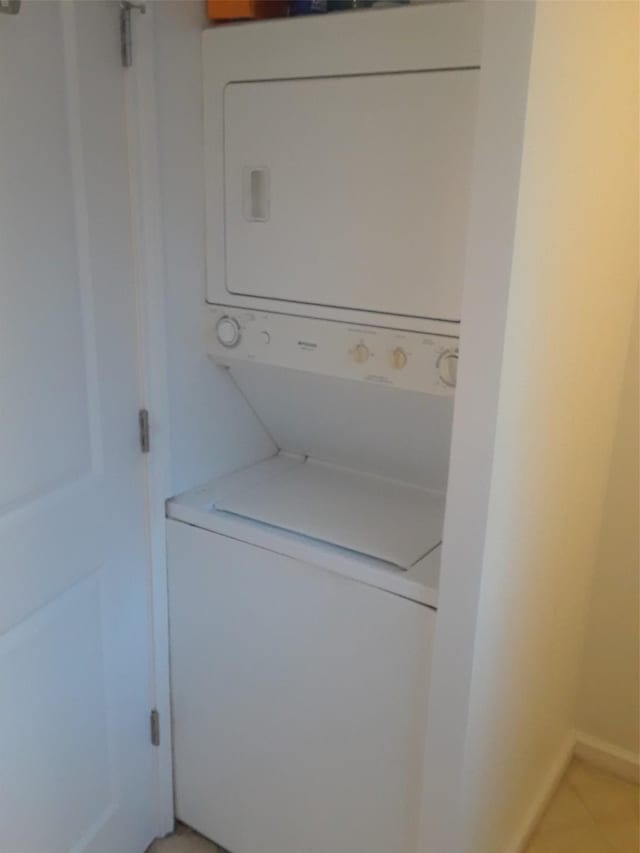 laundry room featuring stacked washer and dryer