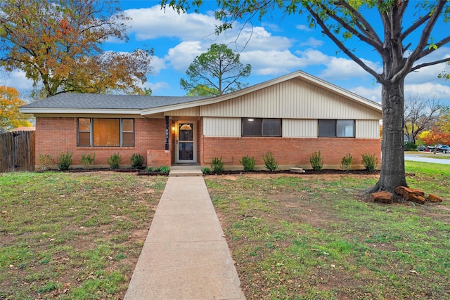 ranch-style house with a front lawn