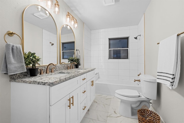 full bathroom with vanity, toilet, and tiled shower / bath combo