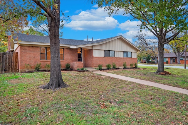 single story home with a front lawn