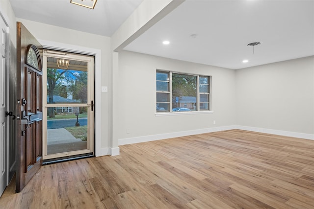 foyer with light hardwood / wood-style flooring and plenty of natural light