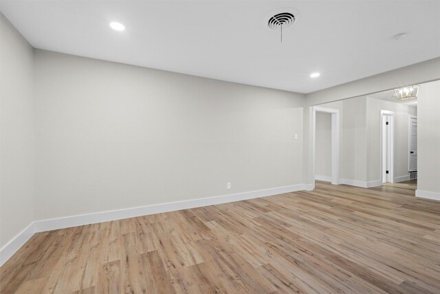 spare room with light hardwood / wood-style floors