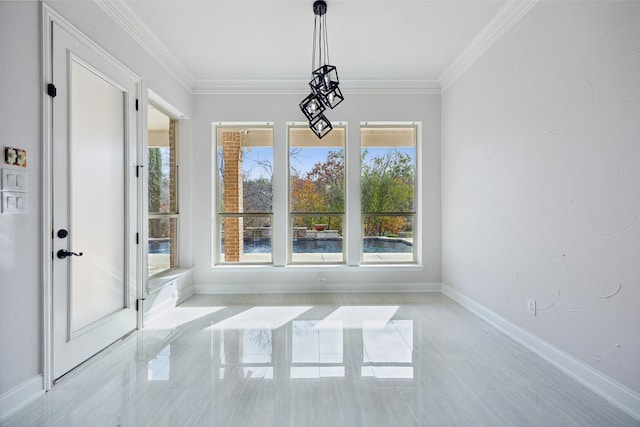 unfurnished dining area with marble finish floor, baseboards, and ornamental molding