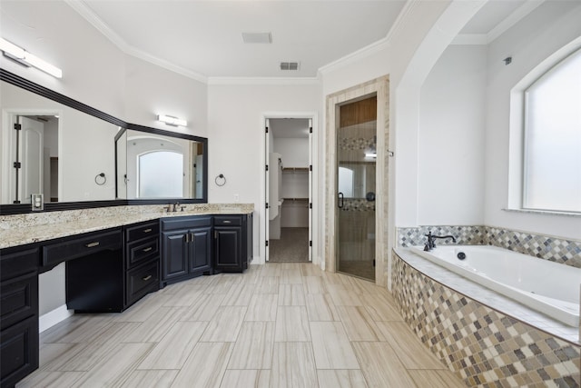 bathroom featuring a garden tub, visible vents, a shower stall, plenty of natural light, and crown molding