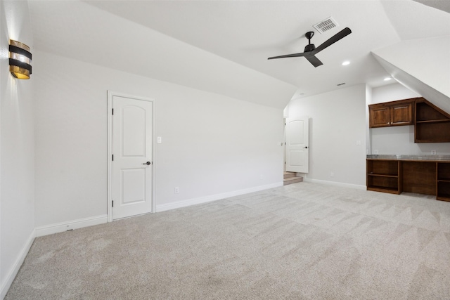 unfurnished living room featuring lofted ceiling, light carpet, visible vents, and recessed lighting