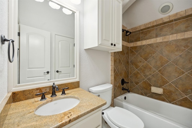 full bathroom featuring toilet, a textured wall, shower / washtub combination, and vanity