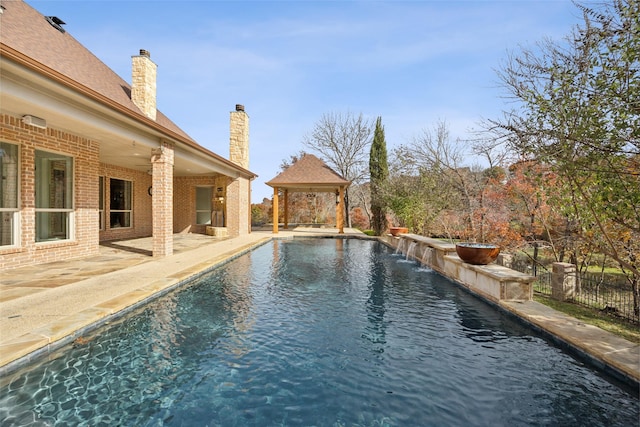 view of pool featuring a gazebo, a patio, fence, and a fenced in pool