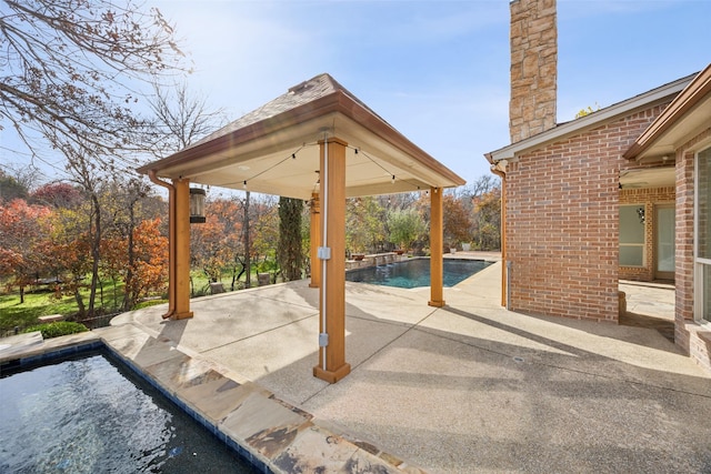 view of patio / terrace with an outdoor pool