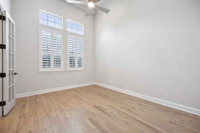 unfurnished room featuring light hardwood / wood-style flooring and ceiling fan