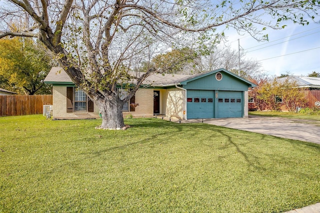 single story home with a garage and a front lawn