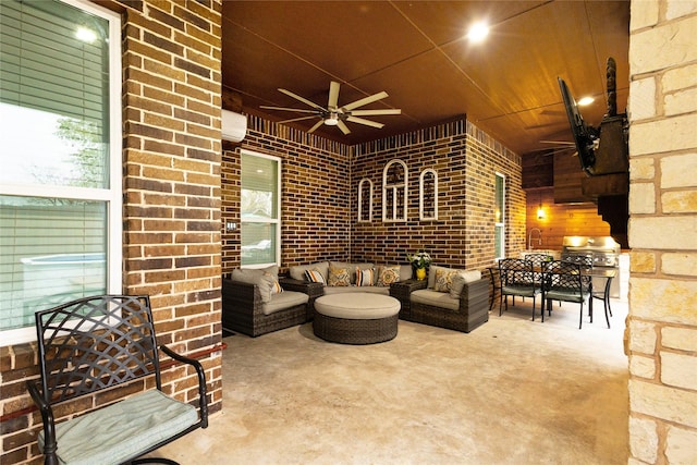 view of patio featuring ceiling fan, a wall unit AC, an outdoor living space, and grilling area