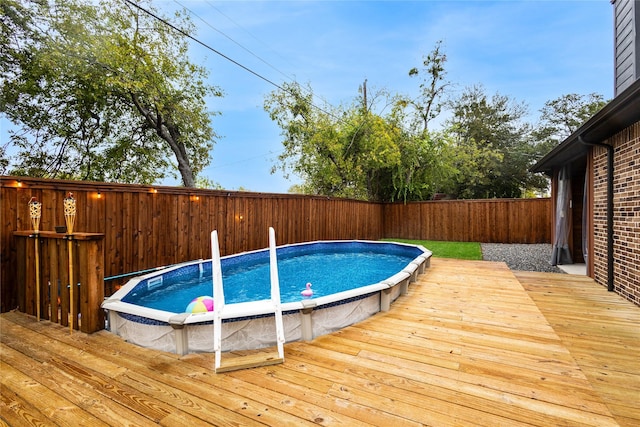 view of pool featuring a wooden deck