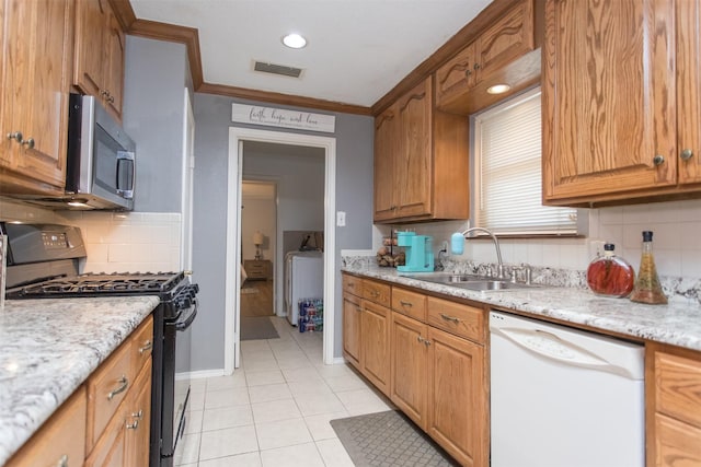 kitchen featuring black gas range, backsplash, white dishwasher, sink, and ornamental molding