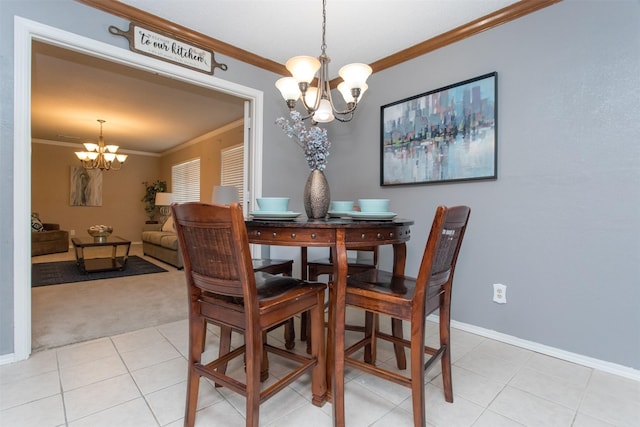 dining room with crown molding, light colored carpet, and a chandelier