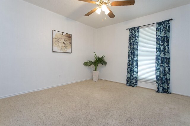 carpeted empty room with ceiling fan