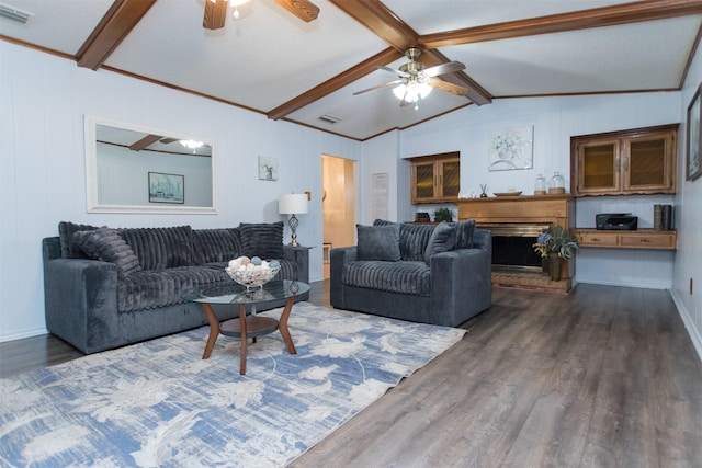 living room with vaulted ceiling with beams, ceiling fan, and dark wood-type flooring