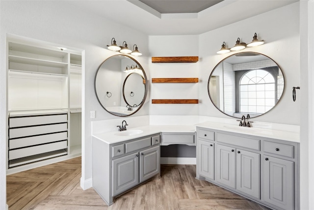 bathroom with parquet flooring and vanity