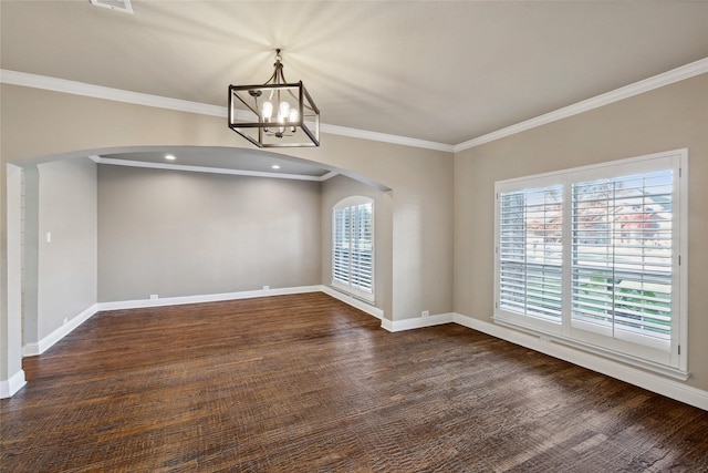 unfurnished dining area with arched walkways, plenty of natural light, and baseboards