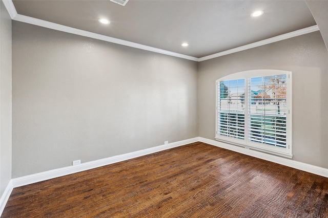 unfurnished room with baseboards, dark wood finished floors, crown molding, and recessed lighting