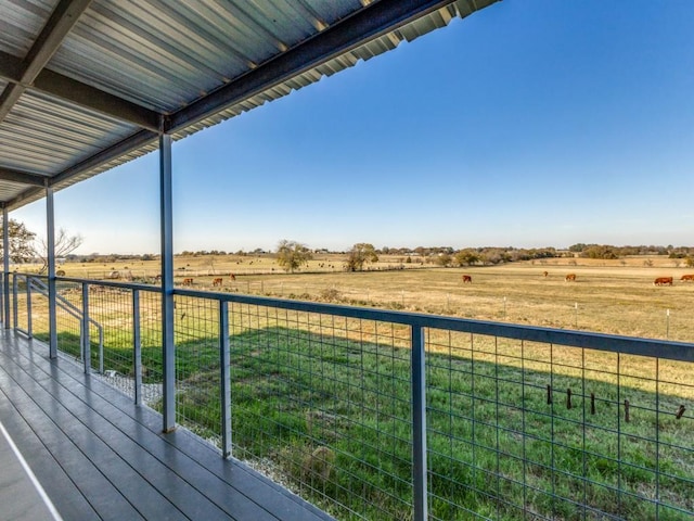 wooden deck featuring a rural view