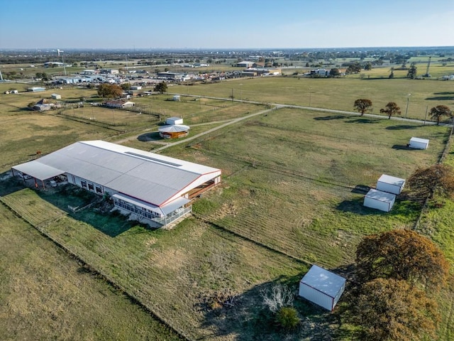 birds eye view of property with a rural view