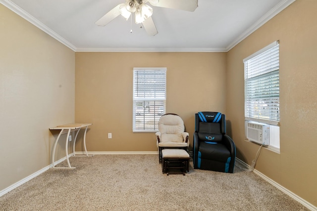 sitting room with cooling unit, ceiling fan, ornamental molding, and carpet flooring