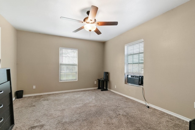 carpeted empty room with cooling unit and ceiling fan