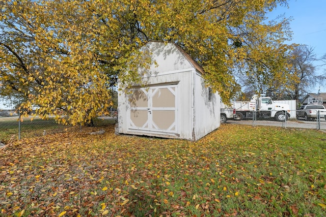 view of outbuilding featuring a yard