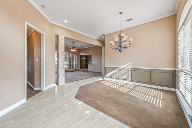 empty room with crown molding, light hardwood / wood-style floors, and ceiling fan with notable chandelier