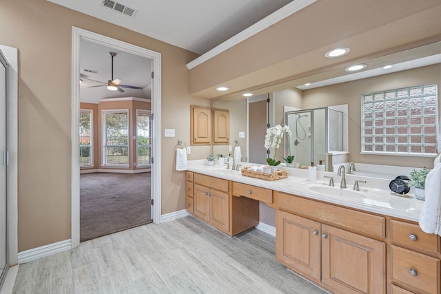 bathroom with vanity, hardwood / wood-style floors, ceiling fan, and a shower with shower door