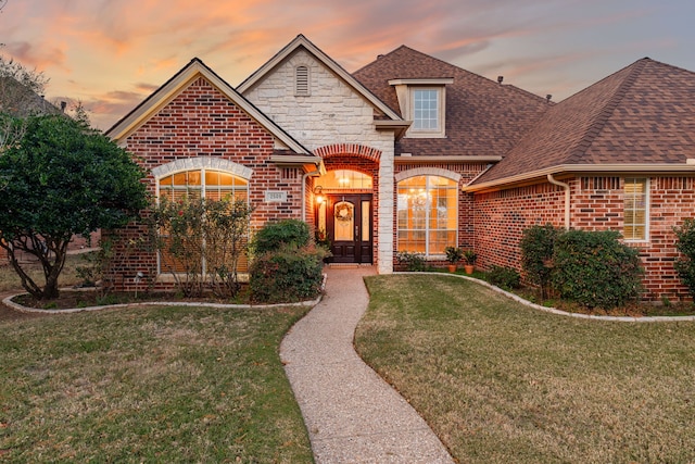 view of front of home with a lawn