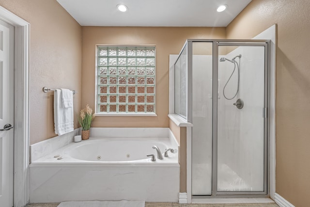 bathroom featuring plus walk in shower