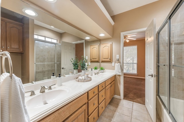 bathroom featuring vanity, bath / shower combo with glass door, tile patterned floors, and ceiling fan